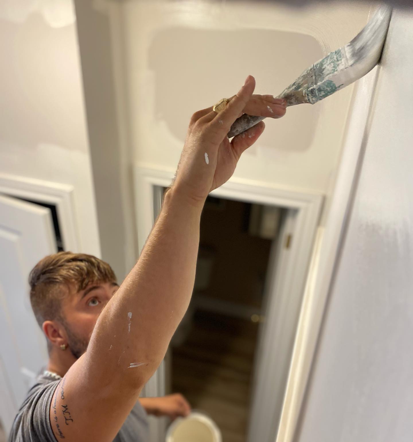 Kevlar craftsman cutting in paint at ceiling with precision, Hamilton Ontario