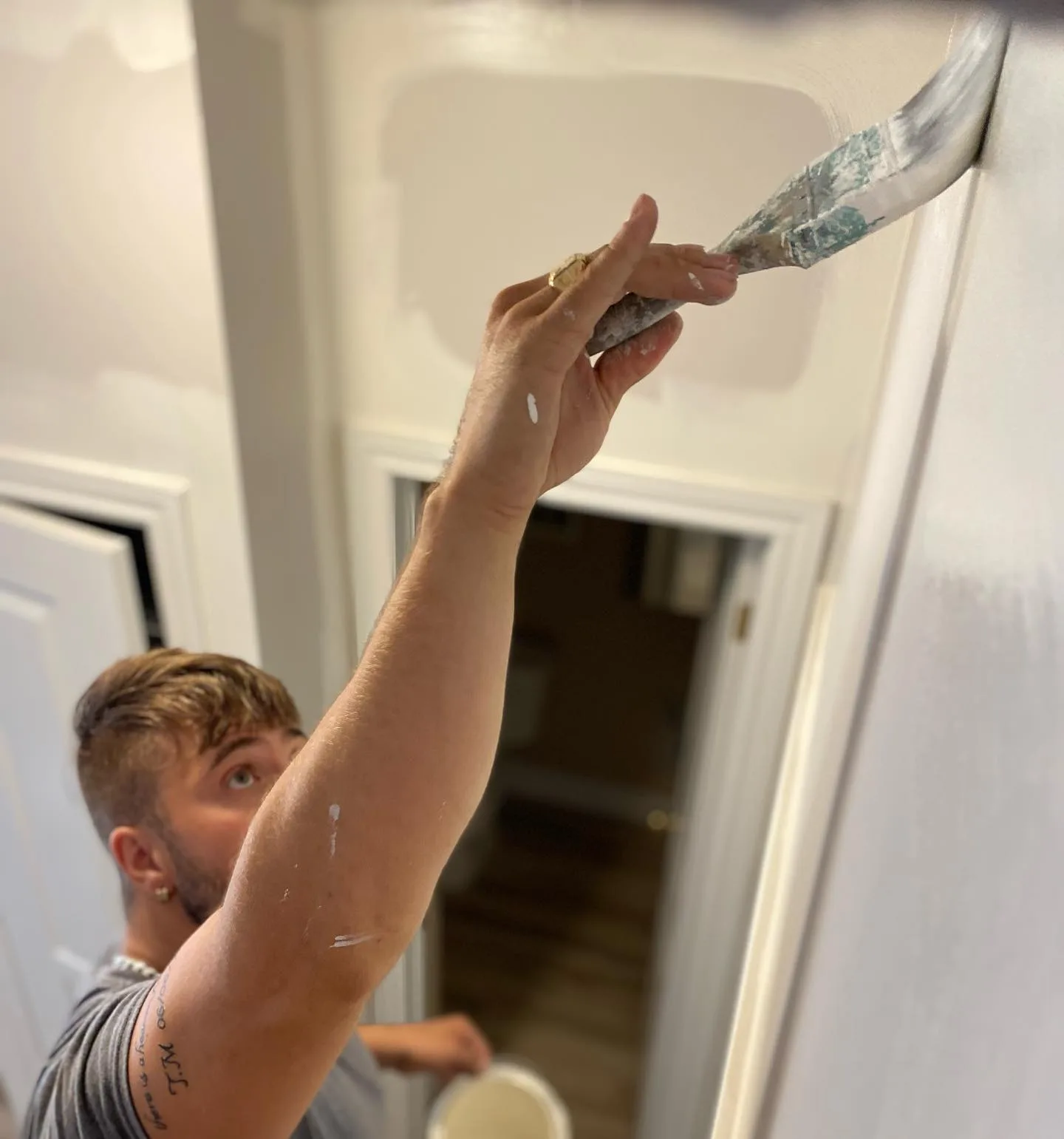 Kevlar craftsman cutting in paint at ceiling with precision, Hamilton Ontario
