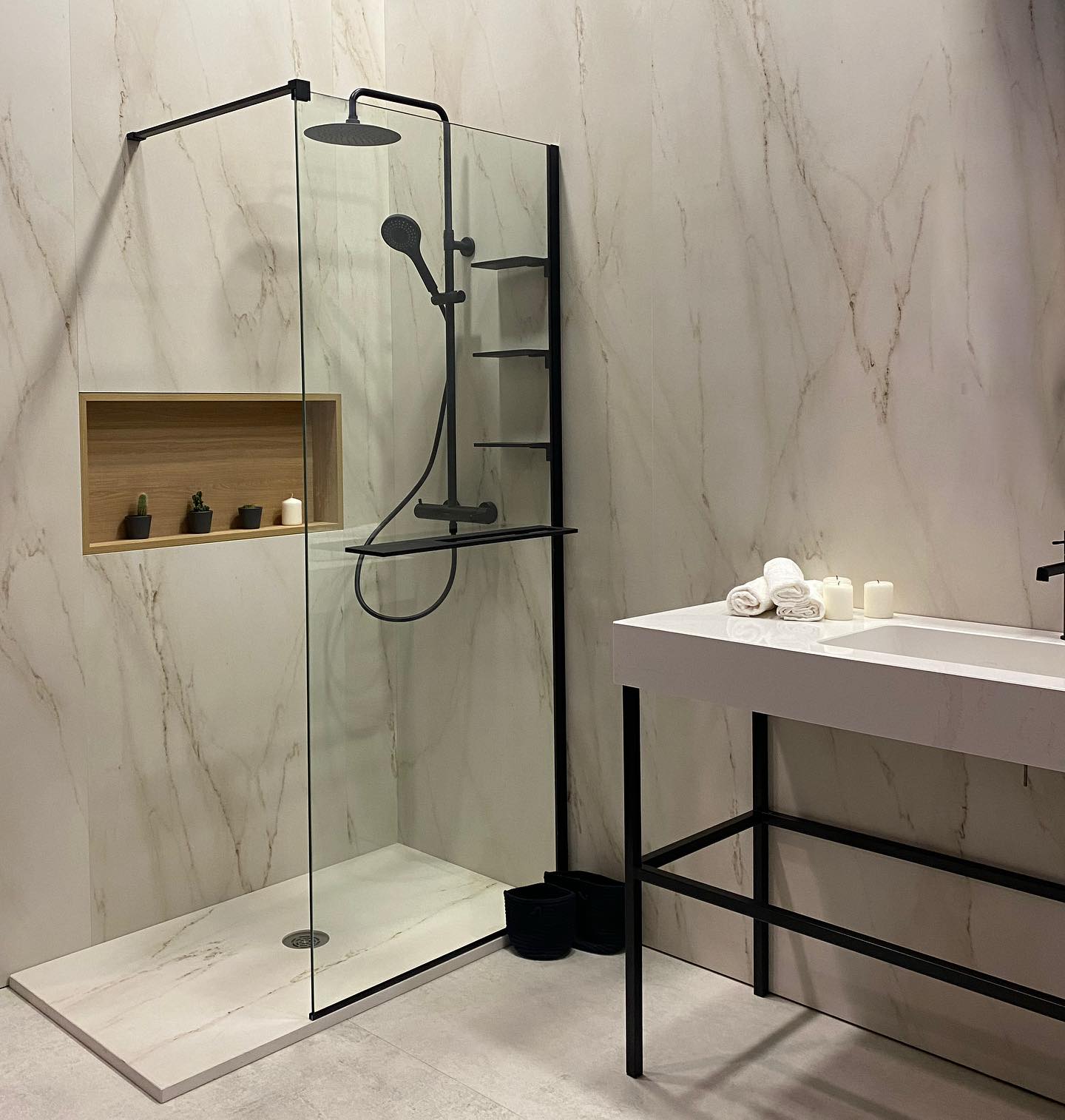 Marble wet room with matte black fixtures and glass shower, Hamilton Ontario