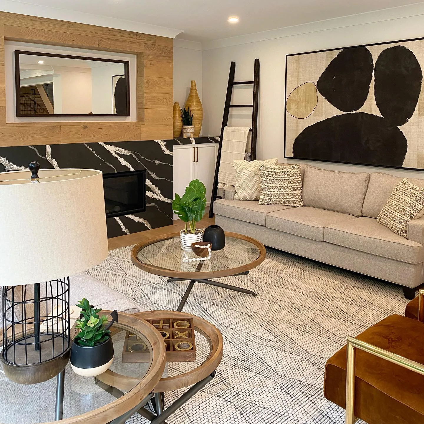 Living room with custom marble fireplace surround and wood slat accent wall, Hamilton Ontario